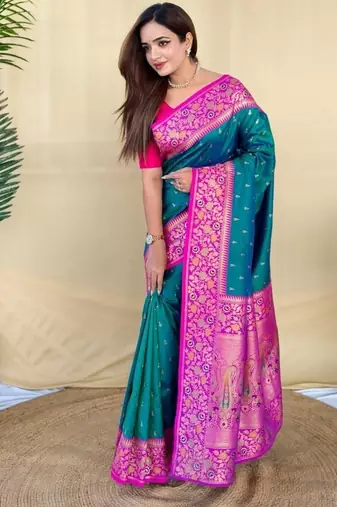 teal green soft silk saree adorned with delicate zari woven buttas