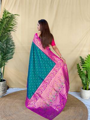 teal green soft silk saree adorned with delicate zari woven buttas 4