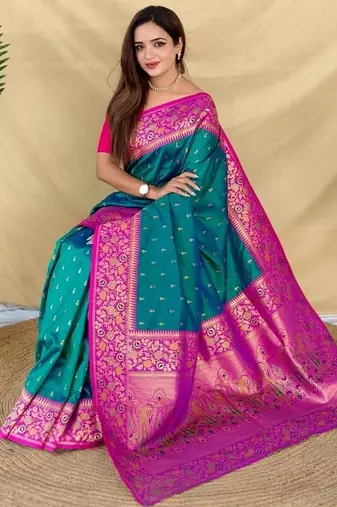 teal green soft silk saree adorned with delicate zari woven buttas