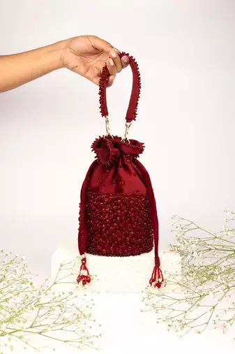 Zaria maroon suede crystal embellished bucket bag