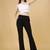 Women solid black regular fit mid-rise flat front trousers