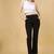 Women solid black regular fit mid-rise flat front trousers