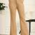 Women solid beige regular fit mid-rise flat front trousers