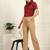 Women solid beige regular fit mid-rise flat front trousers