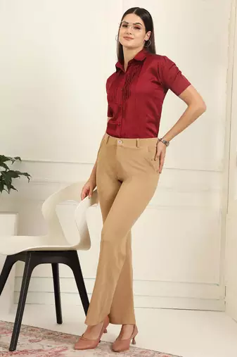 Women solid beige regular fit mid-rise flat front trousers