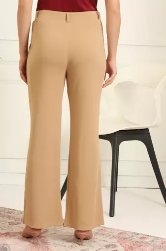 Women solid beige regular fit mid-rise flat front trousers