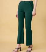 Women solid green regular fit mid-rise flat front trousers