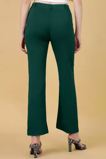 Women solid green regular fit mid-rise flat front trousers