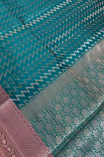 Banarasi semi silk saree in turquoise colour with zig-zag  work