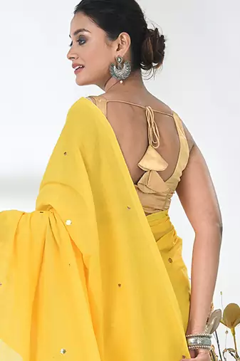 Elegant yellow cotton handspun saree with sequin embellishments and pom pom