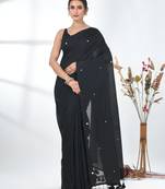 Elegant black cotton handspun saree with sequin embellishments and pom pom