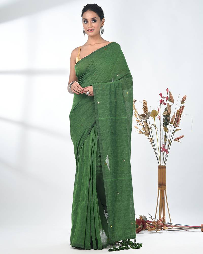 Elegant green cotton handspun saree with sequin embellishments and pom pom