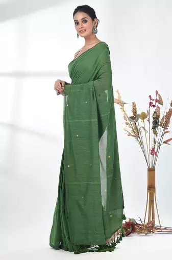 Elegant green cotton handspun saree with sequin embellishments and pom pom