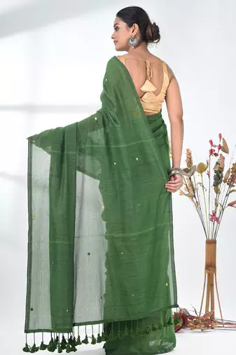 Elegant green cotton handspun saree with sequin embellishments and pom pom