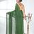 Elegant green cotton handspun saree with sequin embellishments and pom pom