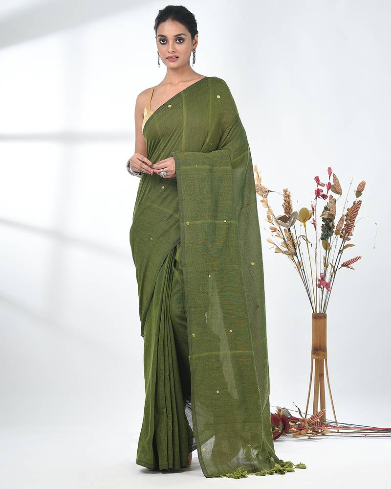 Elegant sap green cotton handspun saree with sequin embellishments and pom pom