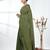 Elegant sap green cotton handspun saree with sequin embellishments and pom pom