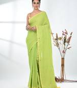 Elegant lime green cotton handspun saree with sequin embellishments and pom pom