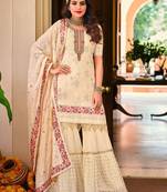 Pure georgette party wear sharara in off white color with embroidery work