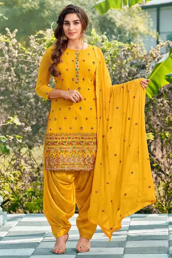 Pure georgette wedding wear suit in yellow color with embroidery work