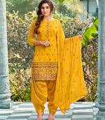 Pure georgette wedding wear suit in yellow color with embroidery work