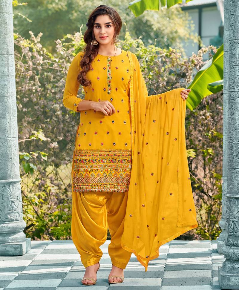 Pure georgette wedding wear suit in yellow color with embroidery work