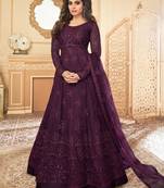Butterfly net fabrics wedding wear gown in violet color with embroidery work