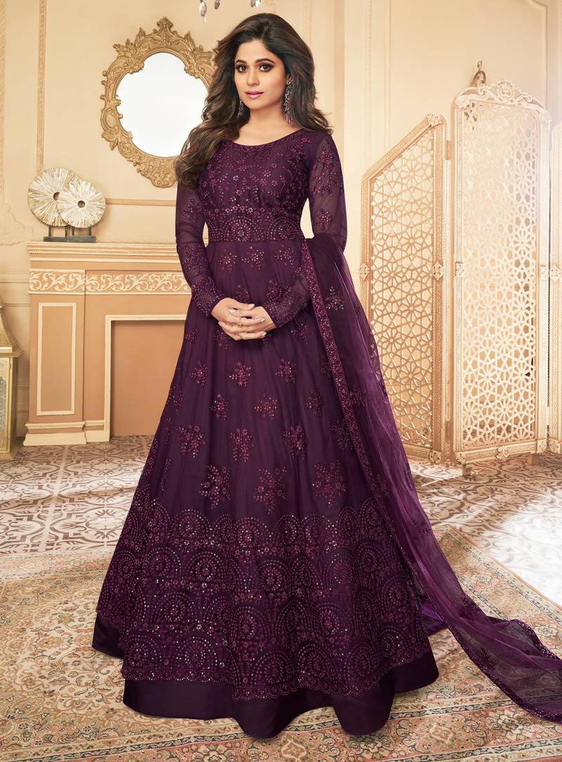 Butterfly net fabrics wedding wear gown in violet color with embroidery work