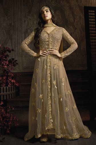 Butterfly net fabrics wedding wear gown in golden color with embroidery work