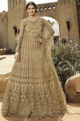Soft premium net wedding wear gown in golden with embroidery & stone work 1