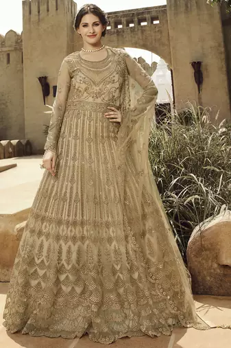 Soft premium net wedding wear gown in golden with embroidery & stone work