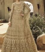 Soft premium net wedding wear gown in golden with embroidery & stone work