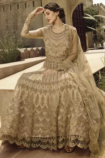 Soft premium net wedding wear gown in golden with embroidery & stone work
