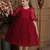 Red pearl embellished net fit & flare party dress for girls