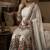 Designer white silk kurta set with heavy floral embroidery & sharara