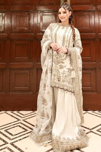 Off white faux georgette readymade suit with embroidery & moti work