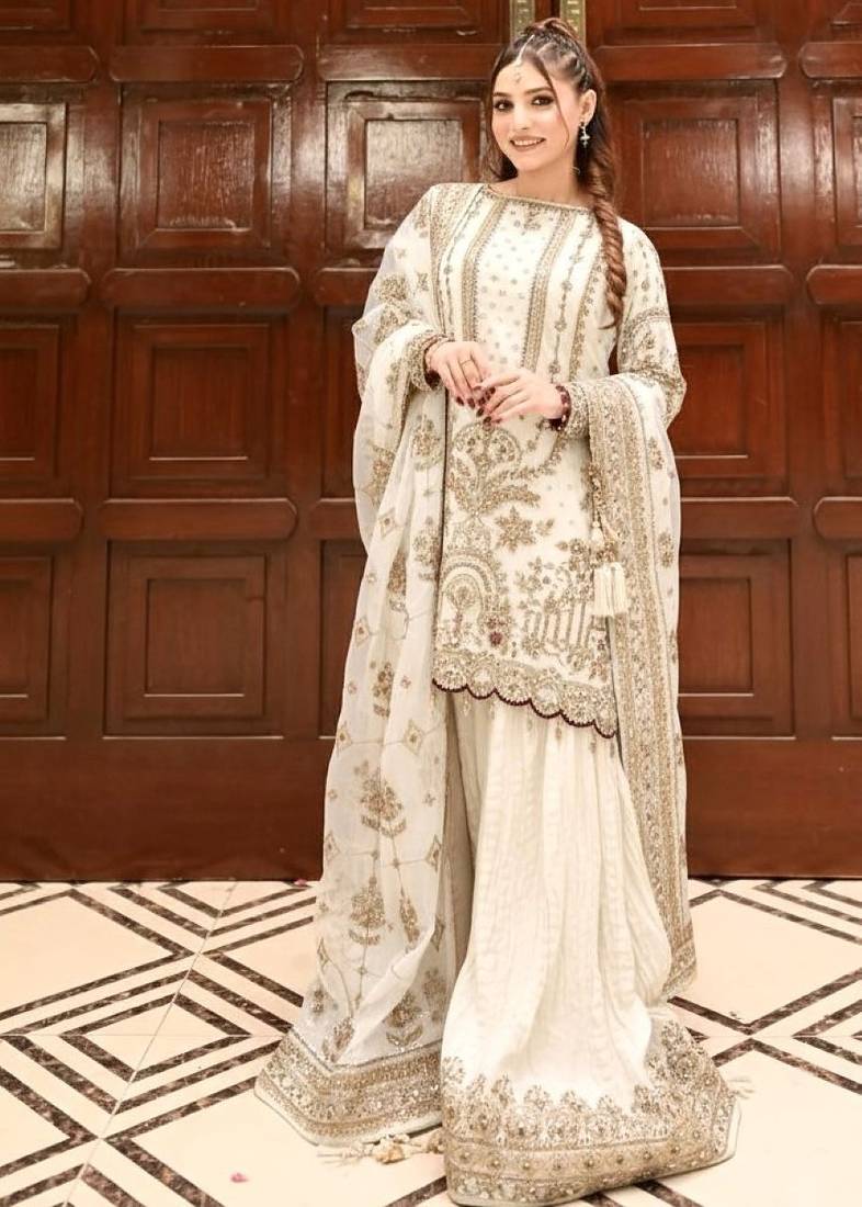 Off white faux georgette readymade suit with embroidery & moti work