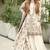 Off white faux georgette readymade suit with embroidery & moti work