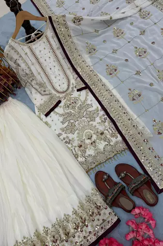 Off white faux georgette readymade suit with embroidered moti 