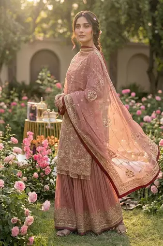 Pink faux georgette readymade suit with embroidery & moti work