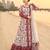 Red & white faux georgette readymade suit with embroidery & tassels attached