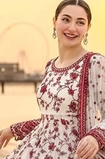 Red & white faux georgette readymade suit with embroidered tassels attached