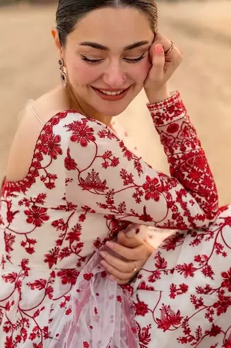 Red & white faux georgette readymade suit with embroidered tassels attached