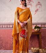 Mustard self printed chinnon silk zari weaving work saree