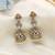 Light pink color american diamond earrings