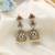 Magenta color american diamond earrings