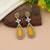 Yellow color kundan earrings