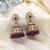 Purple color kundan earrings