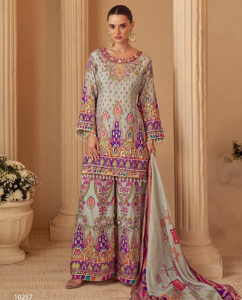Blue crep silk free size stitched suit with digitak print & aari work