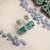 Trendy american diamond crystalgreen earrings